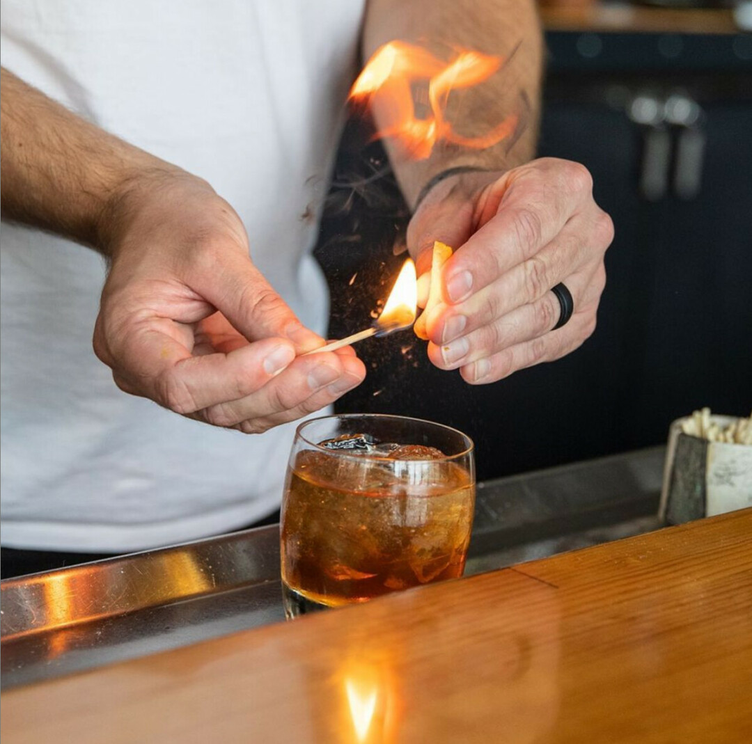 C'MON BABY, LIGHT MY FIRE. The Old Fashioned at The Dive (inside The Lismore Hotel in downtown Eau Claire) includes a flamed orange peel. (Photo by Andrea Paulseth)