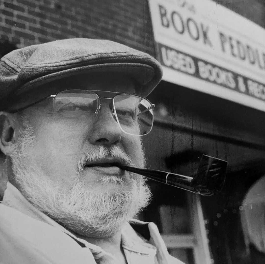 PEDDLER OF BOOKS. The late George Tillema outside the second location of his store, The Book Peddler, during the 1980s when it was 