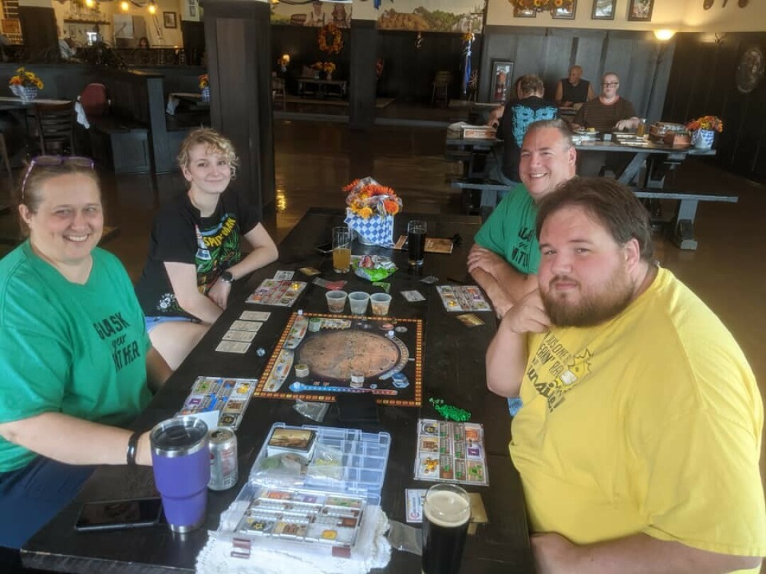 GAMING GET-TOGETHERS: Members of the Eau Claire Board Game Group convene weekly at Clairemont Comics in Eau Claire.