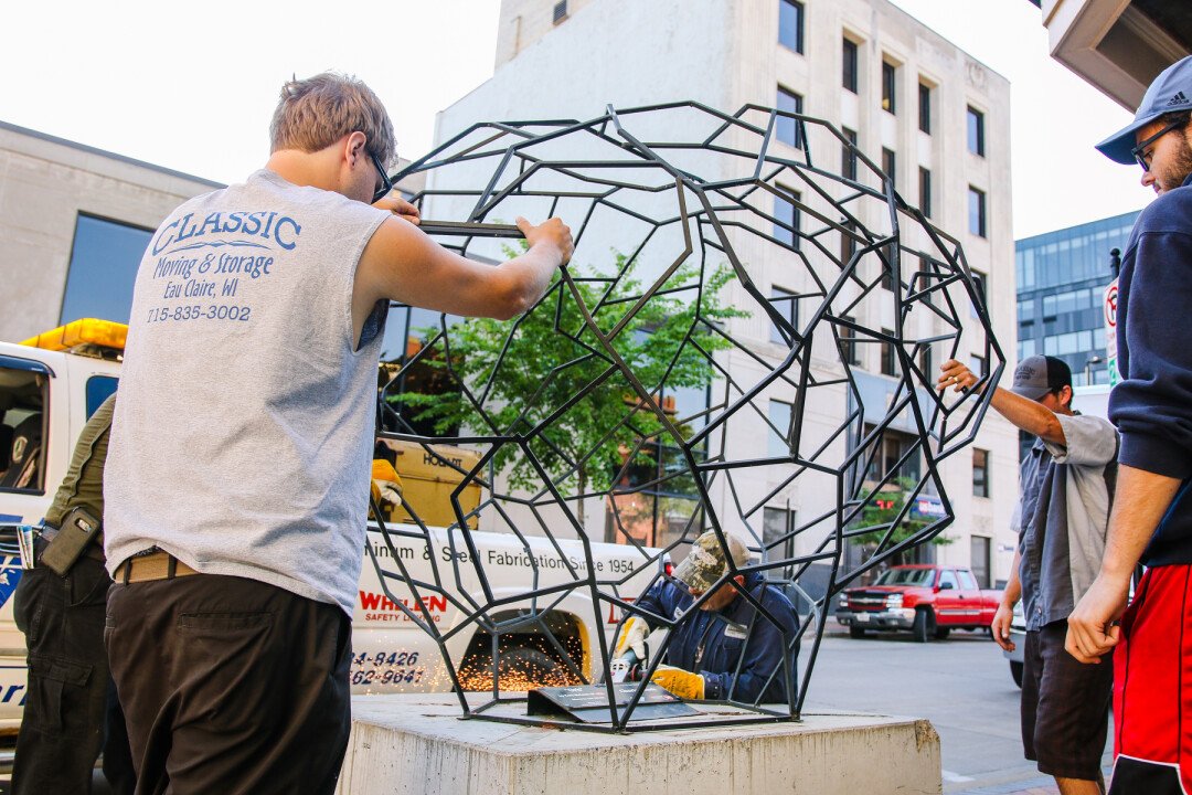 SPARKS WILL FLY. Installing Part of the a Sculpture Tour Eau Claire in 2021.