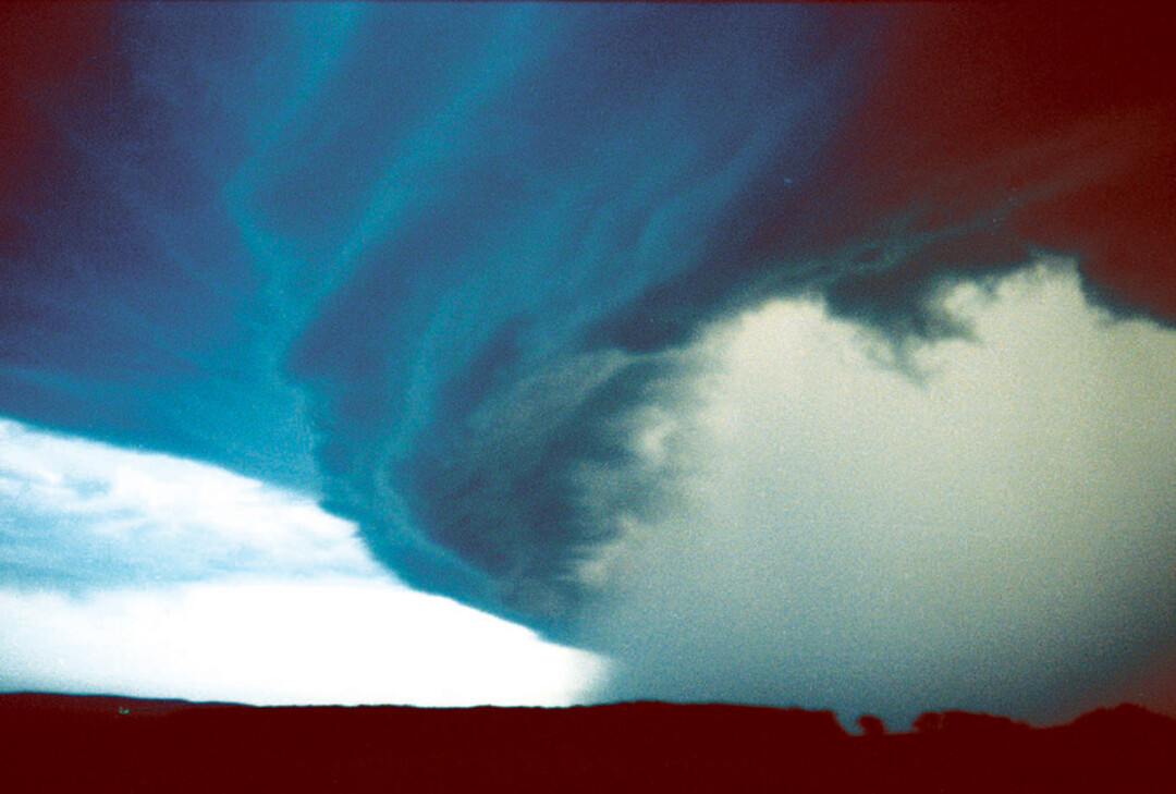 SCARY SKIES. Wayne Thibado captured this photo of the windstorm as it approached Downsville on July 15, 1980.