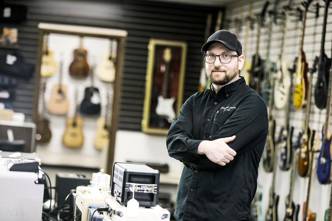 “SUPPORT LOCAL WARRIOR.” That's how Tal Morgan, owner of Morgan Music in Eau Claire, describes himself.