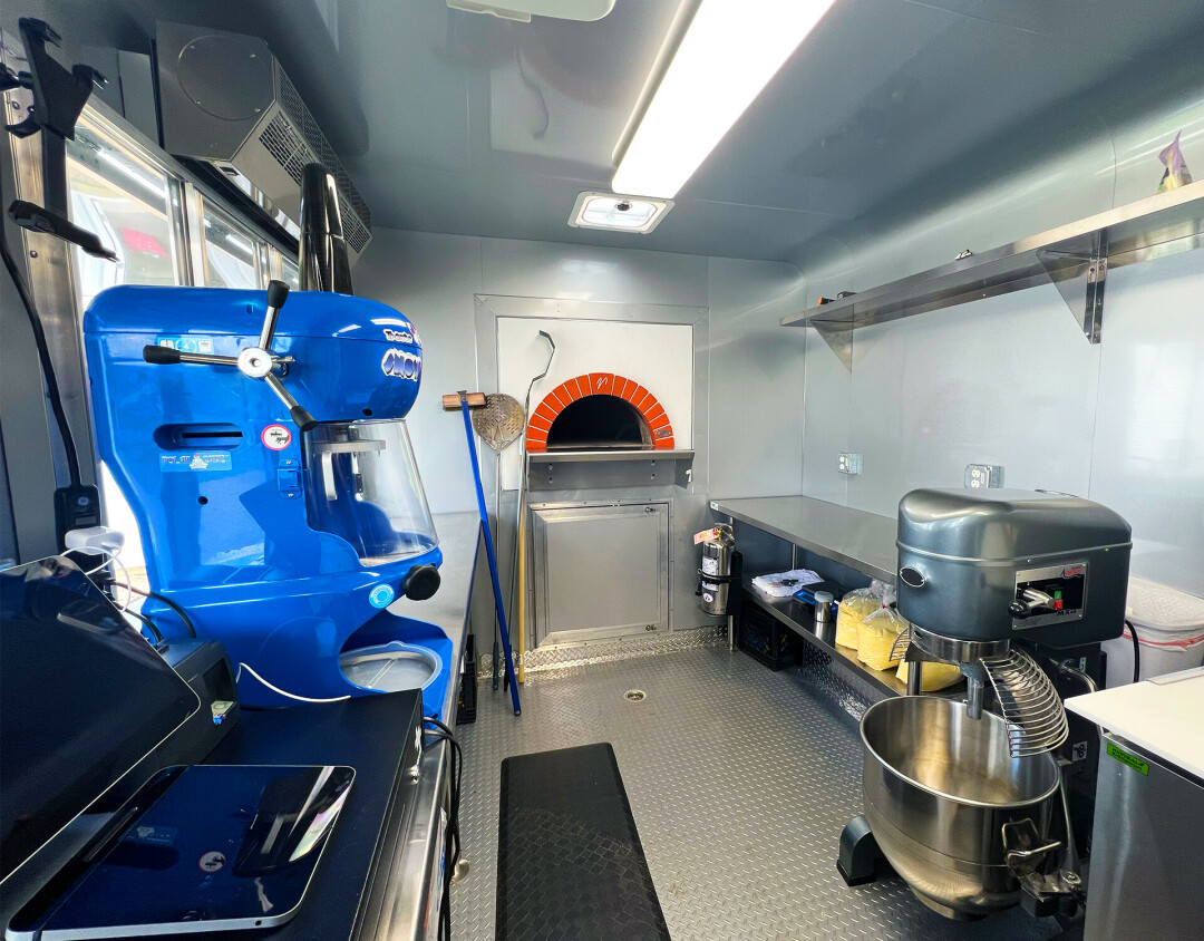 THINKING OUTSIDE THE PIZZA BOX. Ohana Pizza's food truck has a wood-fire oven built right into it, which will run at 900 degrees and pump out their pizzas in about a minute and a half. Also pictured is their giant dough mixer and shave ice machine.