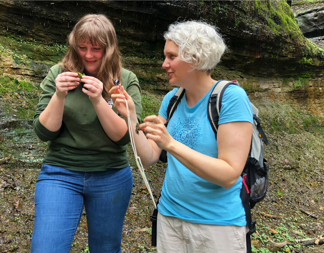 I ASK FOR YOUR GARDEN?  !  UW-Stout biology professor Amanda Little (right) and environmental science student Britney Serafina (left) conduct a study of rare plants in the Punchbowl.