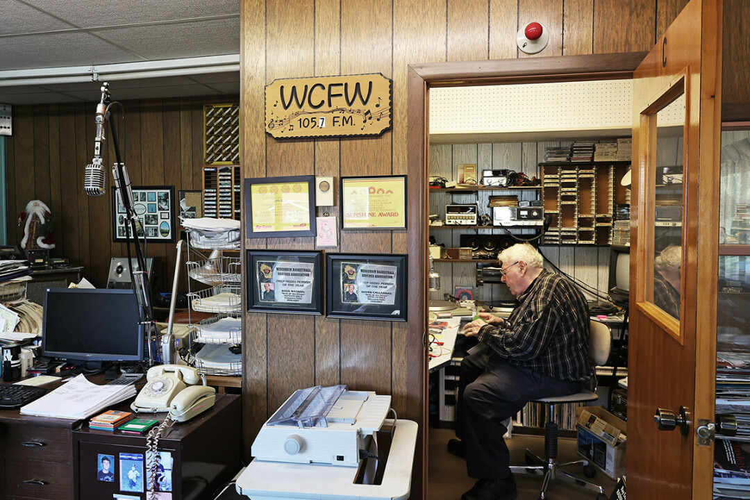 Roland Bushland works in the homey WCFW office in Chippewa Falls.