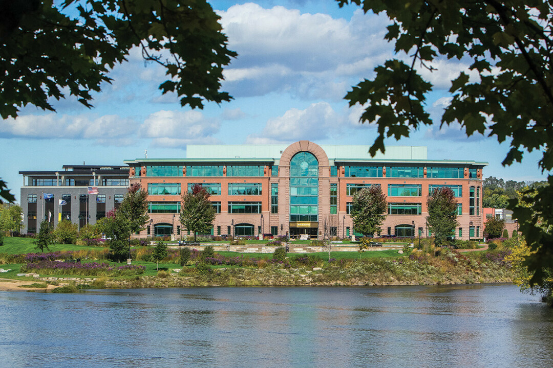 HOME BY THE RIVER. Royal Credit Union's corporate center overlooking Phoenix Park in downtown Eau Claire.