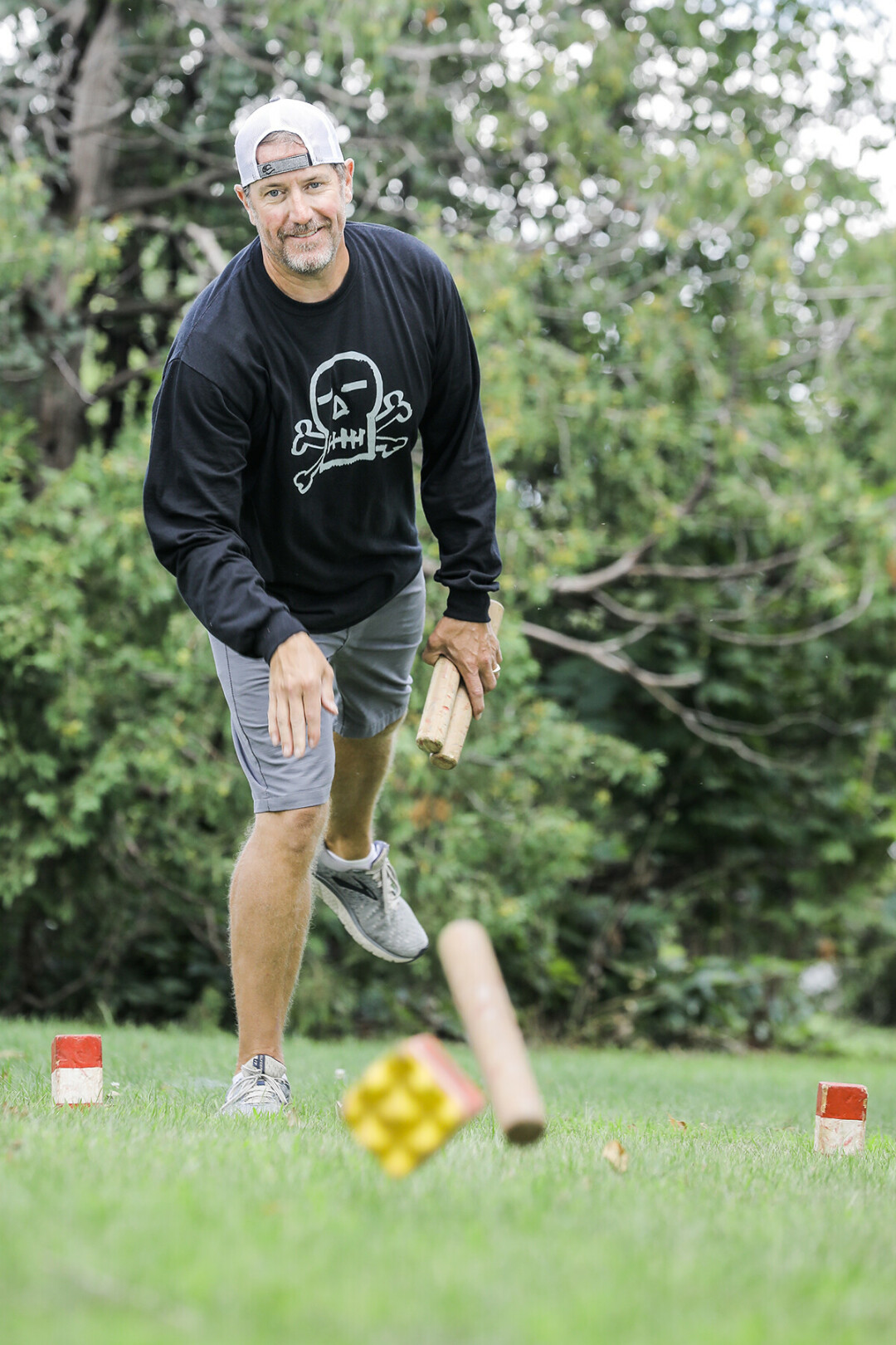 YOU COME AT THE KING, YOU BEST NOT MISS. Eau Claire's Gregg Jochimsen demonstrates his winning kubb form. (Photo by Andrea Paulseth)