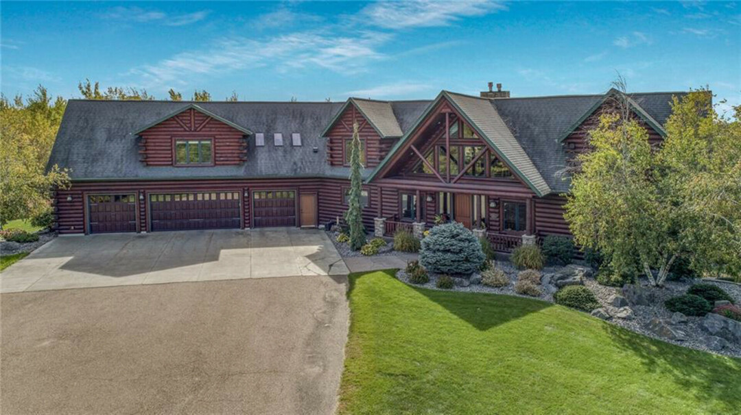 NOT YOUR AVERAGE LOG HOUSE. This 56+ acre log house has six bedrooms and three and a half baths and is listed for $2.2 M. (Photos via Kleven Real Estate)