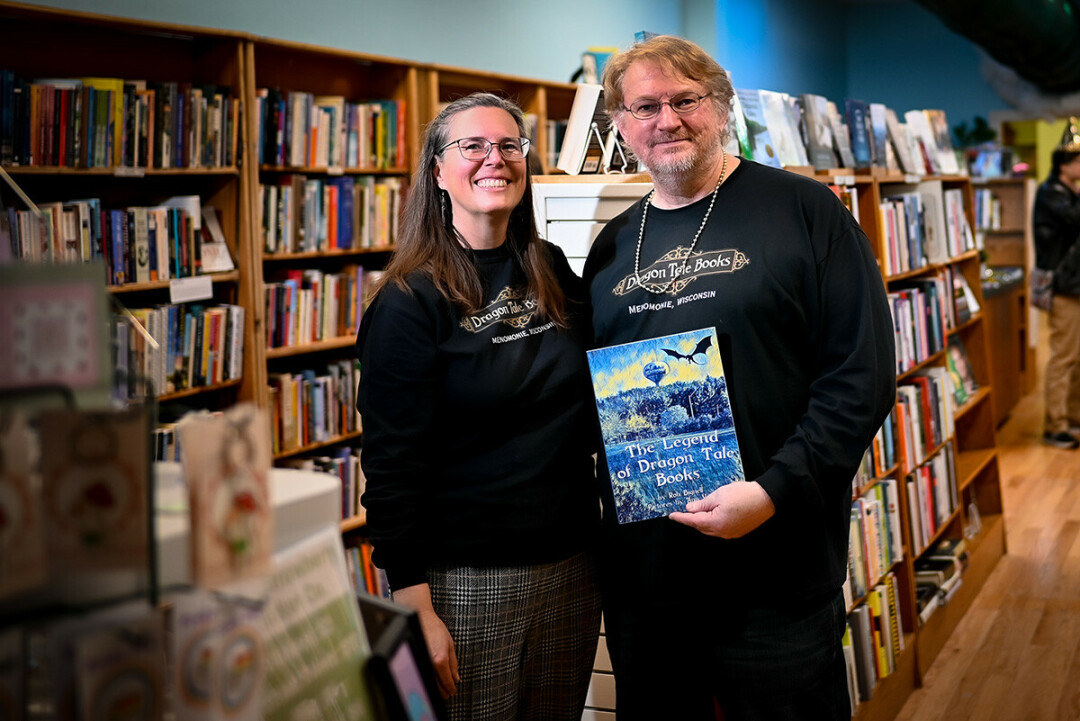 ON DRAGON'S WINGS. Book store proprietor Ann Vogl (leftO collaborated with Menomonie author Rob Bignell (right) on a book, The Legend of Dragon Tale Books. 
