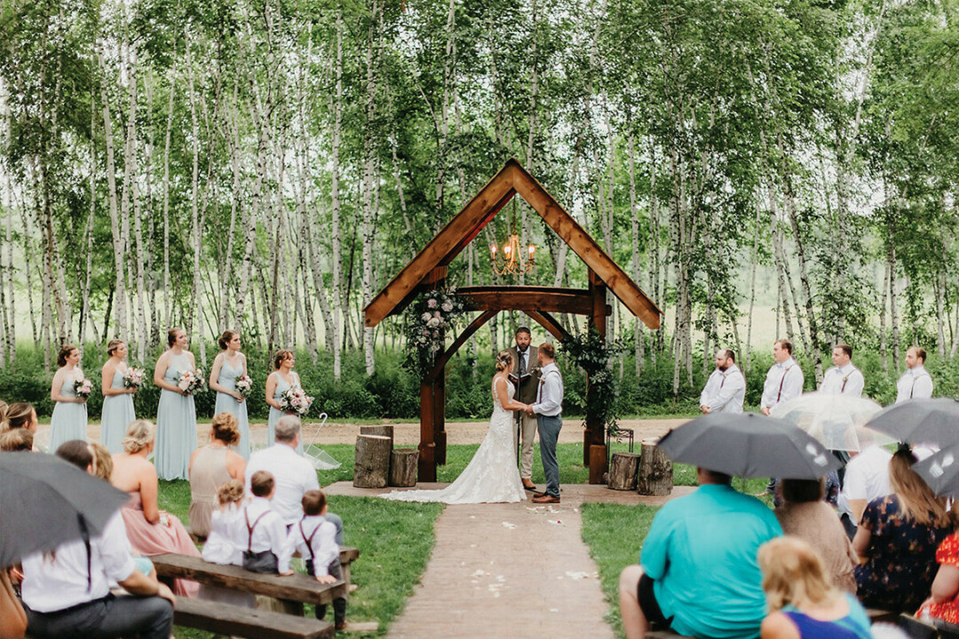 A ceremony at The Woodland. (Photo by Stacy Bengs Photography)