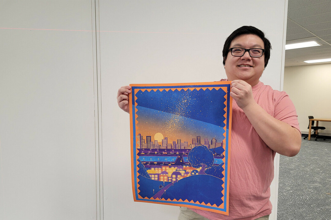 CRAFTING CULTURE. Jackson Yang with his favorite artwork from his master's thesis, 'A Thread through History,' displayed at the University Library Art Lab. (Photos via UW-Stout)