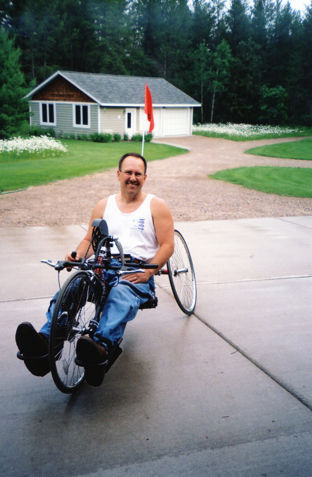 Although he became a paraplegic nearly 50 years ago, Dave Lendle stayed active for decades, including through the use of the hand-powered bicycle at right. 