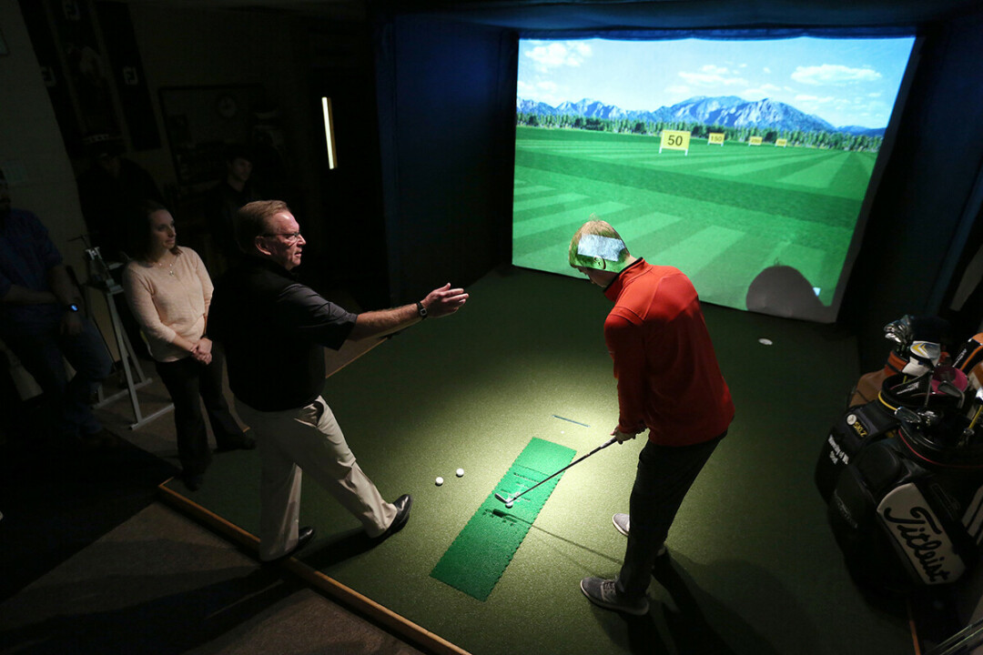 A golf simulator on campus is used for the Fitting and Swing Analysis class in the GEM program. / UW-Stout