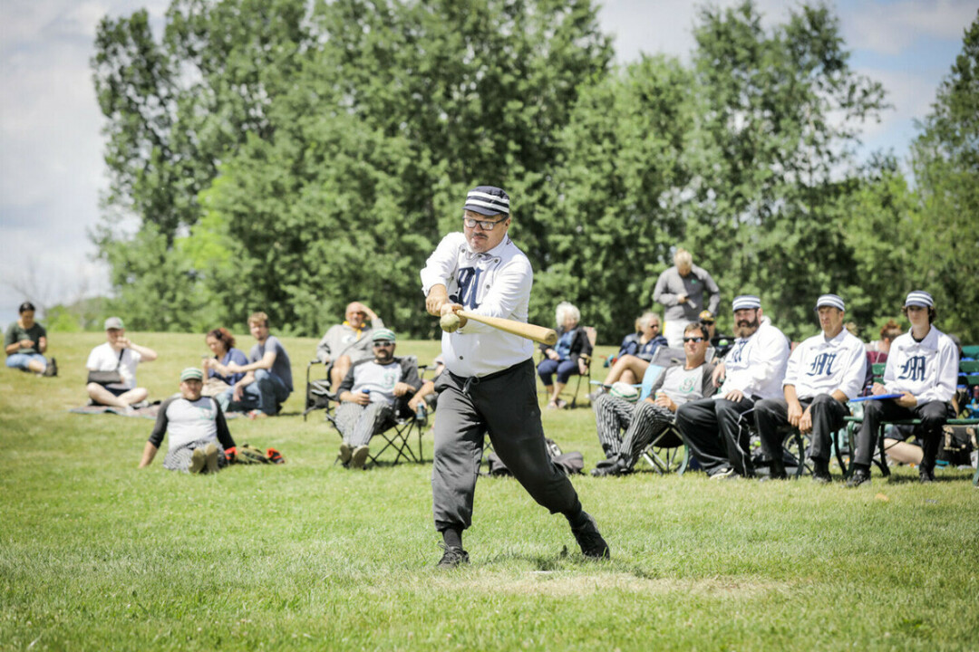 HUZZAH! TIS A HIT! The Menomonie Blue Caps play baseball by vintage rules. (Photo by Andrea Paulseth)