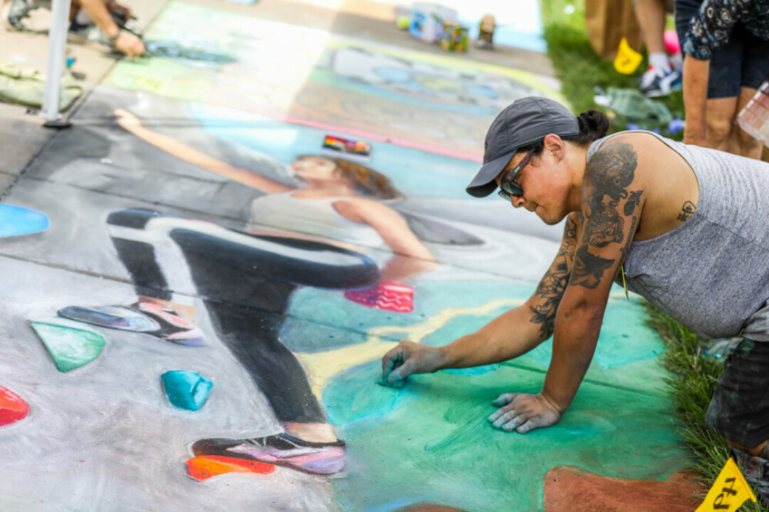 WATCH WHILE THEY WORK. Organizers are hoping more than 200 chalk artists take part in this summer's Chalkfest on the UW-Eau Claire campus.