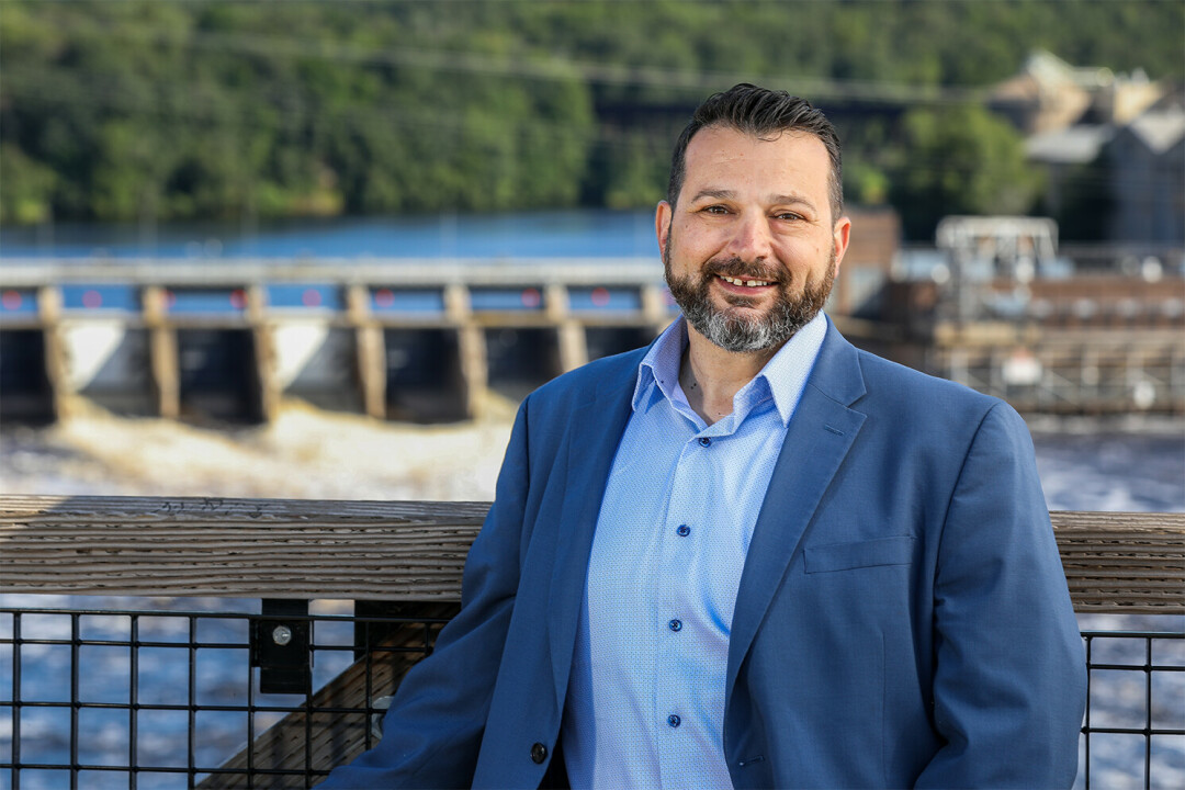 Karl Hoesly on the High Bridge in Eau Claire, which spans the Chippewa River just below the  company’s century-old Dells Hydro.