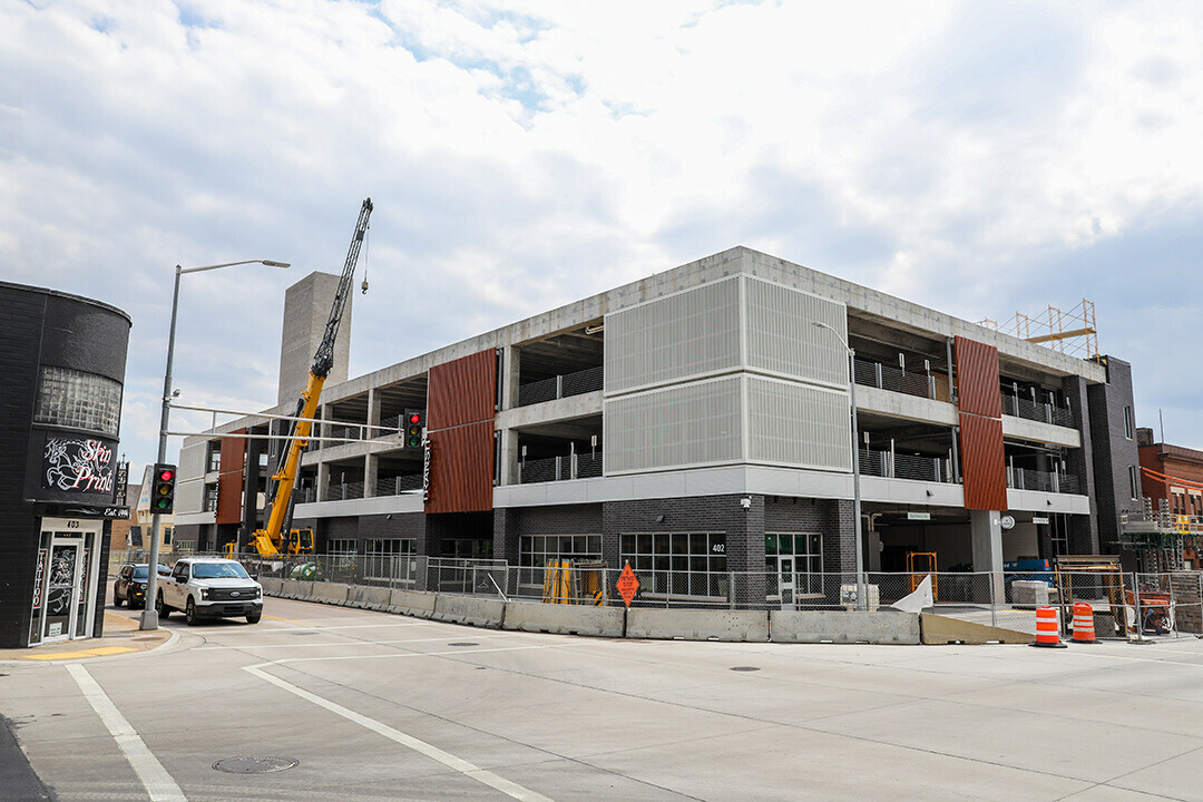 THE LIGHT AT THE END OF THE (BUS) TUNNEL? Construction has been ongoing for several years on the combined transit center-apartment complex on South Farwell Street. The project is expected to be