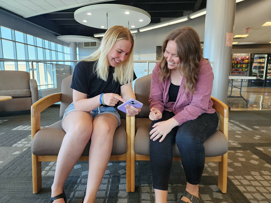 Karly Kibbel, LEFT, and Jordy Miles, nursing students at Chippewa Valley Technical College, discuss the resource guide they created for the Aging & Disability Resource Center of Eau Claire County (ADRC). They said the volunteer opportunity helps caregivers of people who live with dementia but also was a great learning experience.  