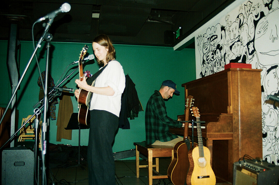 BE OUR GUEST. Courtney Hartman performs on guitar alongside special guest, S.Carey. Throughout the Oct. 15 show at The Good Wives, various Eau Claire artists joined the two headline artists in performance.