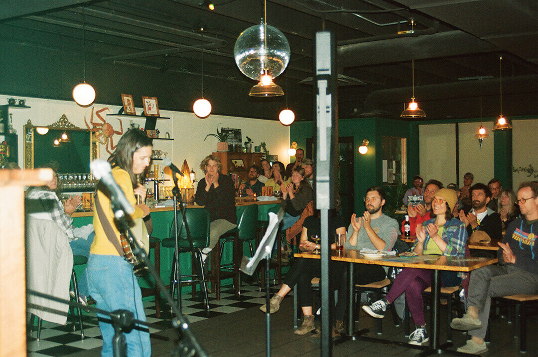 GIVE THEM A HAND. Attendees at The Good Wives cheer and applaud as Luray completes their set Oct. 15, filling the cozy, dimly lit venue with energy. Luray vocalist Shannon Carey said that the intimate atmosphere enhanced the connection between the performer and the engaged audience.