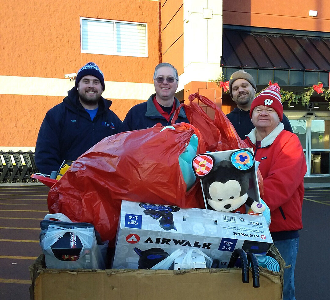 Mid-West Family radio host John Murphy, right, and others collect toys during the 2023 Festival of Toys drive. (Submitted photo)