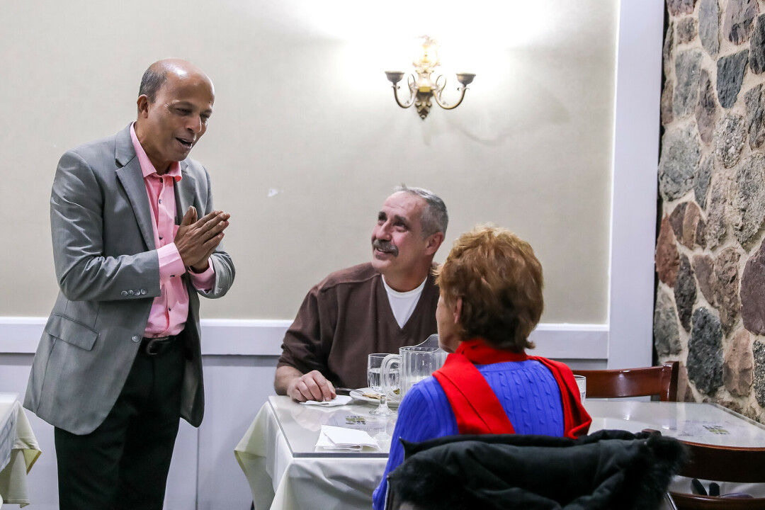 Francis, general manager, pictured at left chatting with customers. Art, pictured at right, had eaten both lunch and dinner at New Maharaja – two days in a row.