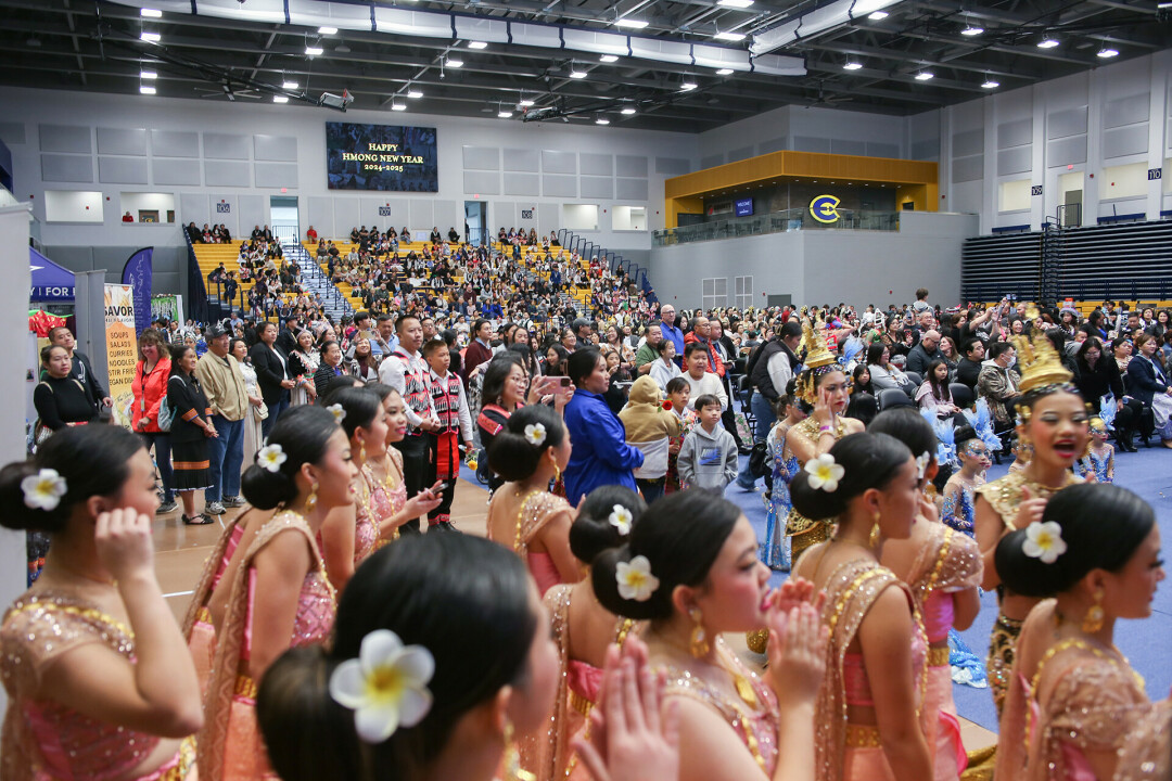 CULTIVATING & CONNECTING. Eau Clare Hmong New Year, pictured, welcomed a dozen traveling competition teams, all performing traditional Hmong dances. The Chippewa Valley will soon be home to its own competitive team, thanks to the Siab Zoo Dance Program.