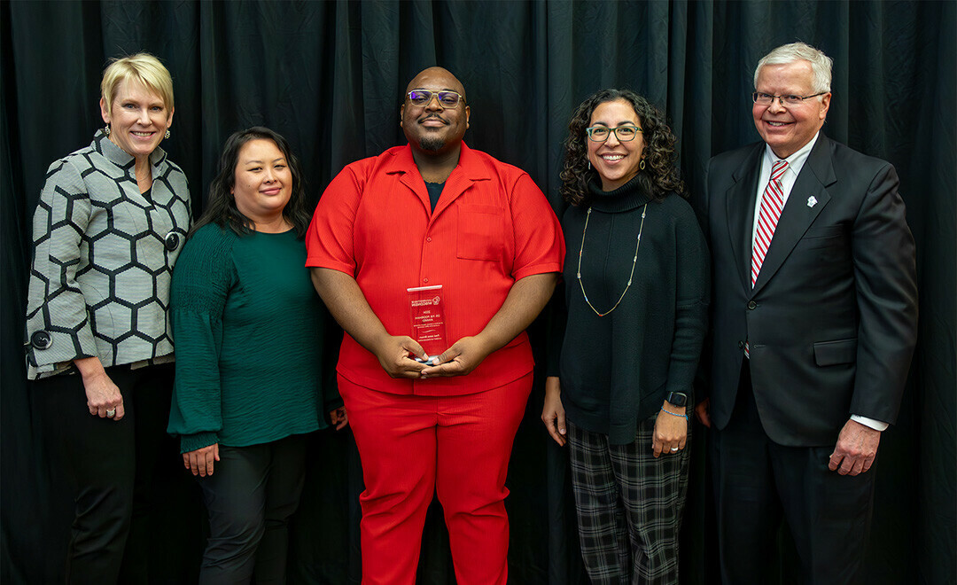 Dr. P.B. Poorman award recipient Fred Jomo Brown (center), with Chancellor Katherine Frank, Executive Director of Student Inclusion and Belonging Mai Khou Xiong, Provost Glendalí Rodríguez and UW President Jay Rothman. Photo contributed by Universities of Wisconsin.