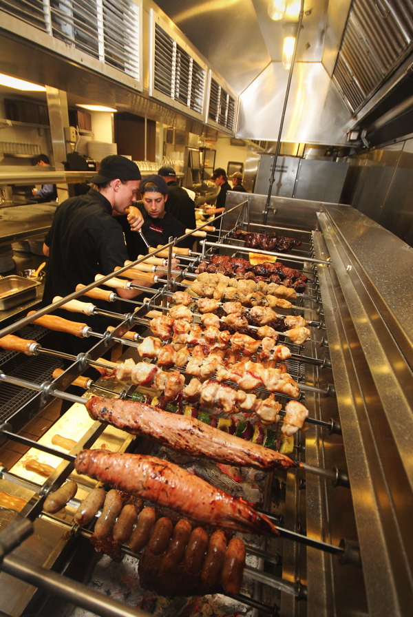 The Picanha Brazilian Steakhouse rotisserie cooks all twelve of its main courses over mesquite charcoal.