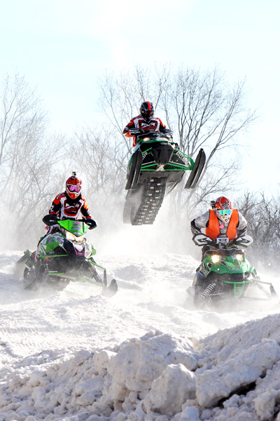 WHY SNOWMOBILE WHEN YOU CAN FLY? Brackett Bar near Fall Creek hosted Snow Biz 2013 on Jan. 26, featuring their annual snow-cross race to benefit United Cerebral Palsy.