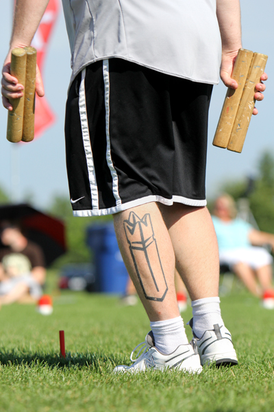 KUBB ... IT GETS UNDER YOUR SKIN. The 2013 U.S. National Kubb Championship took place in Eau Claire on July 13 and 14, with Eau Claire teams placing first (Kubbsicles) and fourth (Kubbitz). Above: Chris Hodges of Team Knockerheads from Des Moines, Iowa, which took third place.