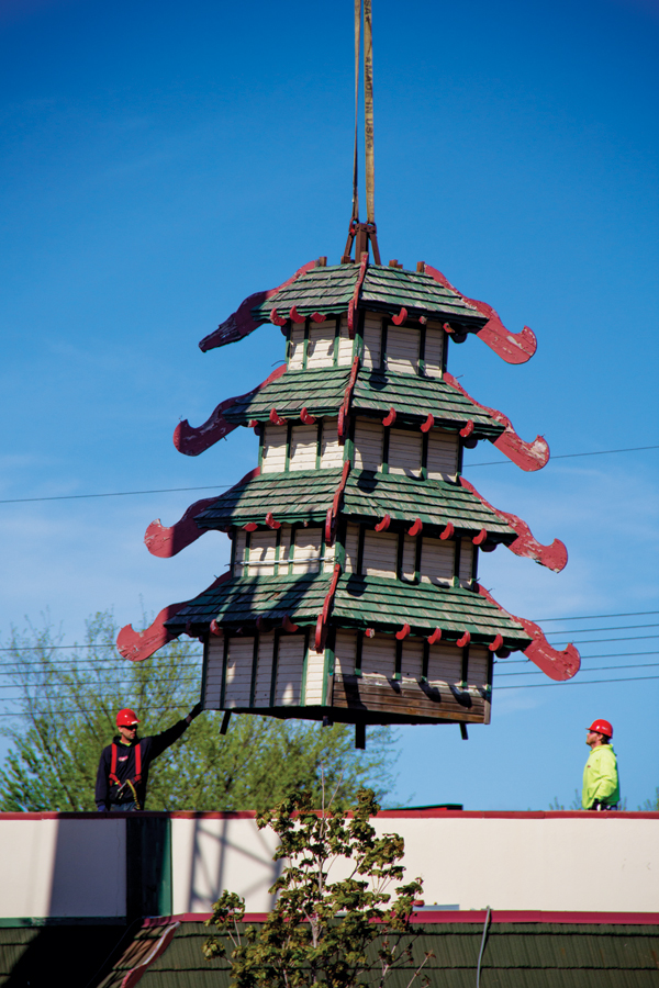 THE PAGODA HAS LEFT THE BUILDING. On May 22, crews detached and removed the iconic pagoda from the former Woo’s Pagoda restaurant on Hastings Way. It now belongs to the Chippewa Valley Museum. 