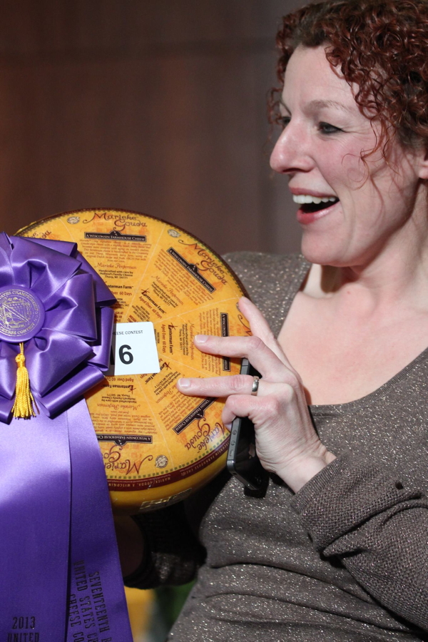 Marieke Penterman shows off her national champion cheese at last year&rsquo;s U.S. Cheese Championship in Green Bay
