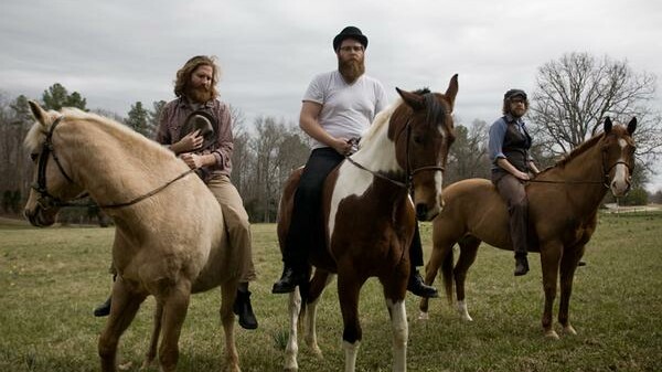 MAIN full horiz - megafaun.jpg 2009-10-13 13:34:57 The now defunct Megafaun's former Eau Clairians Joe Westerlund, Brad Cook, and Phil Cook, shown here straddling unnamed equestrian companions.