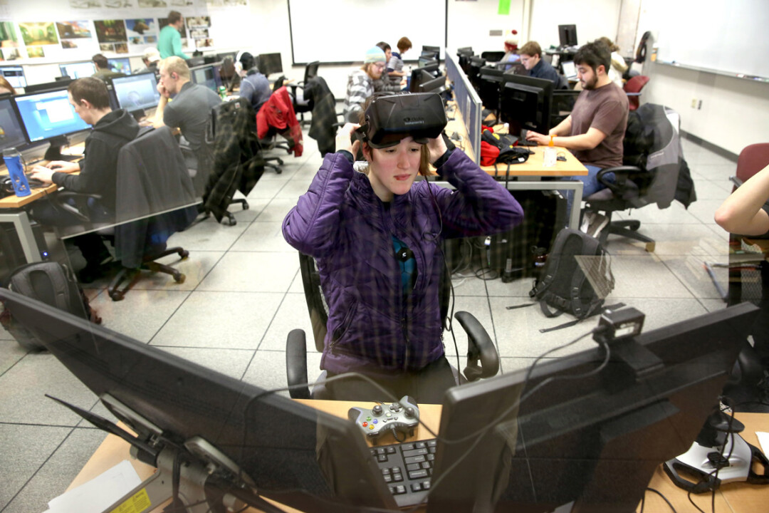 Emily Dillhunt, a senior majoring in game design and development, uses a virtual reality headset while working in a UW-Stout design lab. The game design program has been ranked 21st in the U.S. and Canada by Princeton Review.