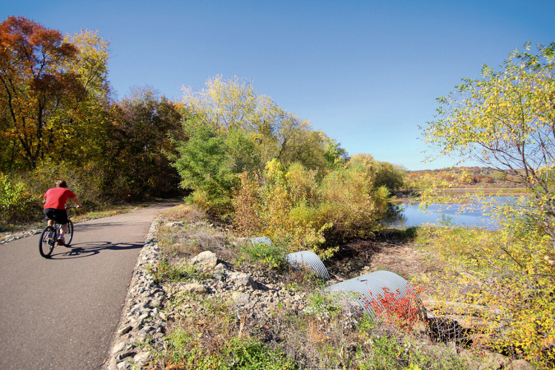 PEDAL PUSHER. Users of the Chippewa River Trail, shown above, will be able to bike all the way to Chippewa Falls – and beyond – when the final gap in the adjacent Old Abe State Trail is completed as early as 2018.