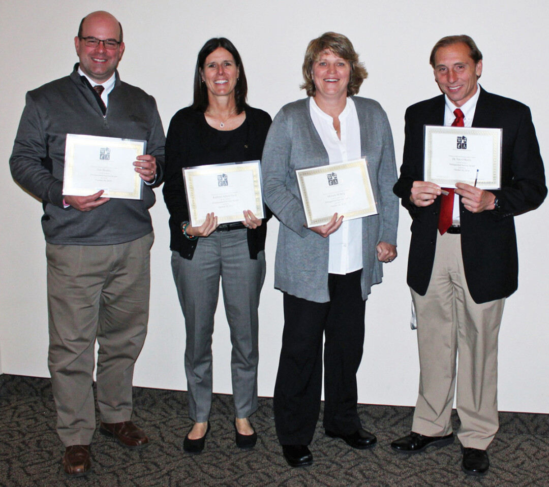 Art education Award-winners, from left to right, Tim Skutley, Kathryn Schiefelbein, Michele Wiberg, and Dr. Tim O’Reilly.