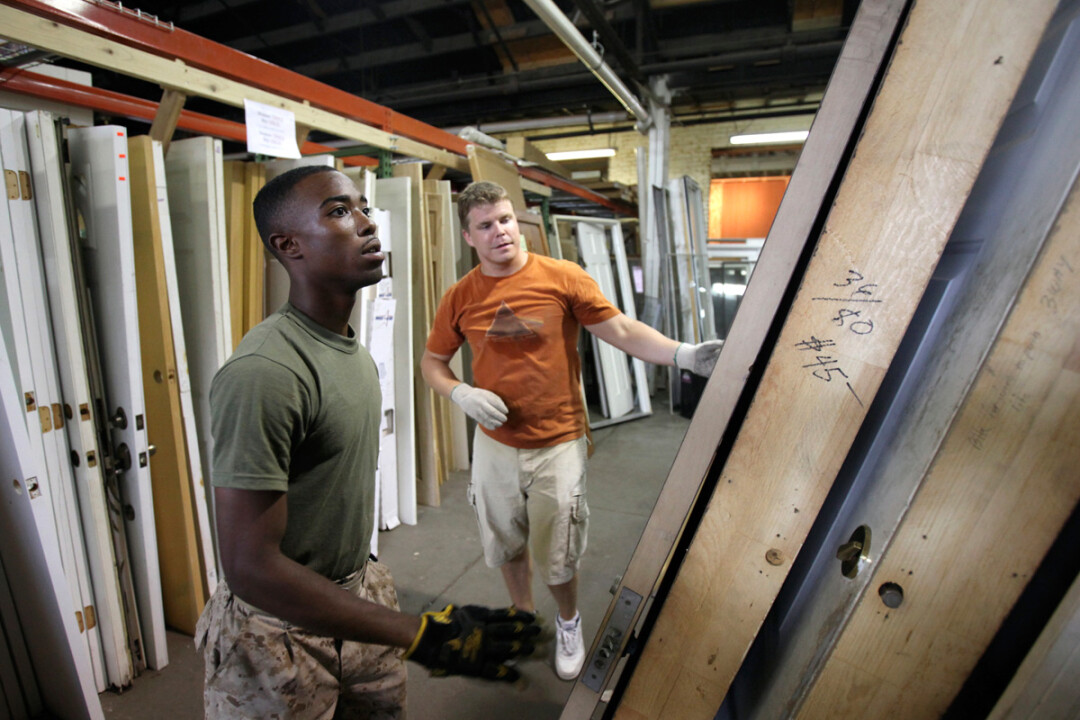 DOORWAY TO DONATIONS. Volunteers work at a Habitat for Humanity ReStore in St. Louis in 2011. This spring the Chippewa Valley Habitat chapter plans to open a similar store selling new and used building supplies. Image: U.S. Marine Corps