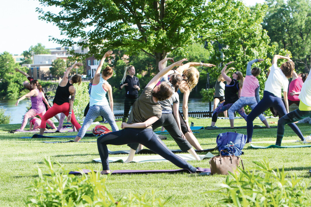 High-five free yoga is a peaceful outdoor yoga gathering in Eau Claire’s Phoenix Park with sessions on Thursday nights before the Sounds Like Summer Concert Series and Saturday mornings during the Artist Market.