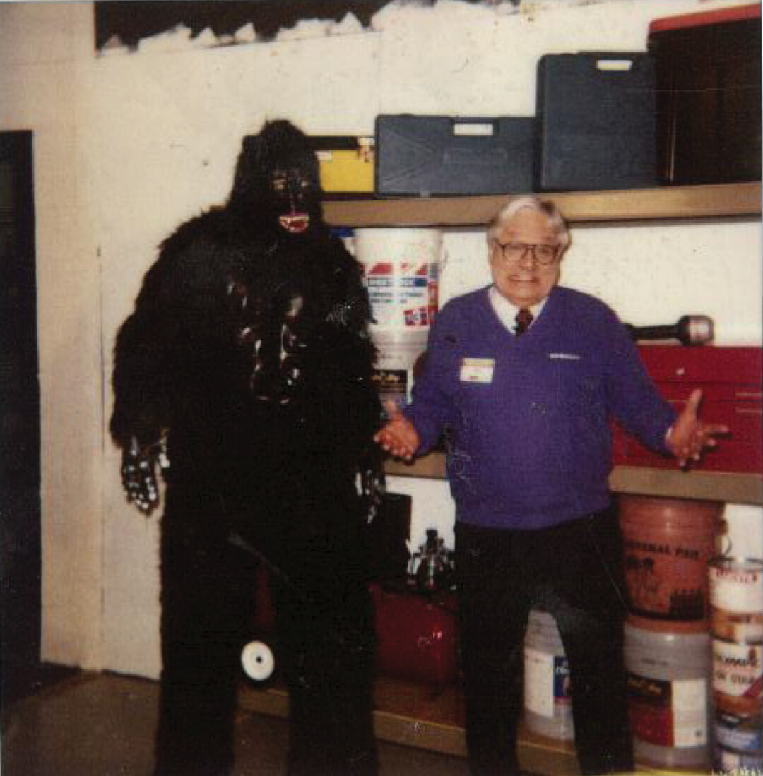 Ray Szmanda on set at a Menards commercial shoot for Gorilla Rack Shelving, circa 2001. Volume One owner/publisher Nick Meyer is the guy in the gorilla suit – it was his job to jump into the frame, hop up and down, and pound his chest. Ray had plenty of monkey jokes for the crew.